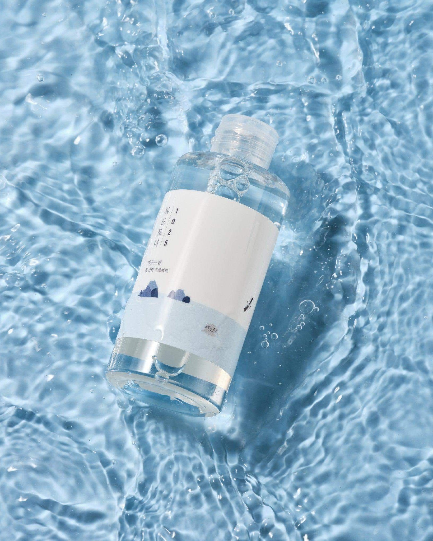 Bottle with a label floating on water