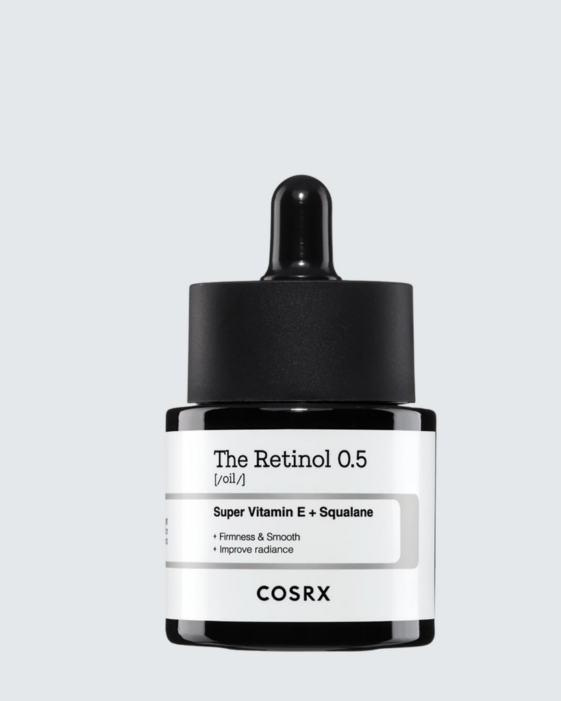 Cosrx skincare dropper bottle on a light gray background