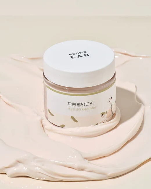Skincare jar with 'Round Lab' branding on a beige background