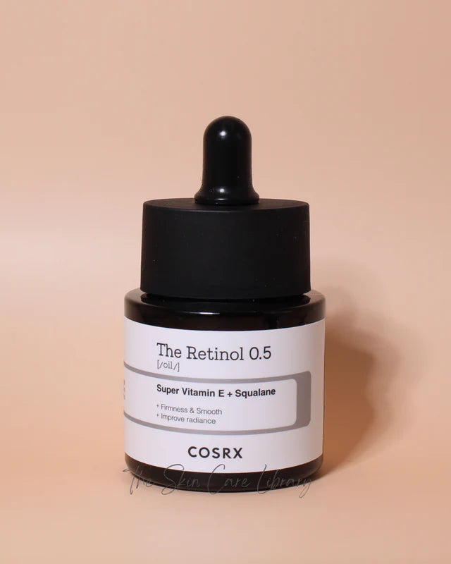 Cosrx skincare serum bottle with dropper on a beige background