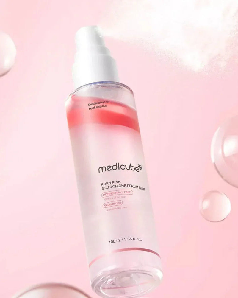 Medicube serum bottle on a pink background with bubbles
