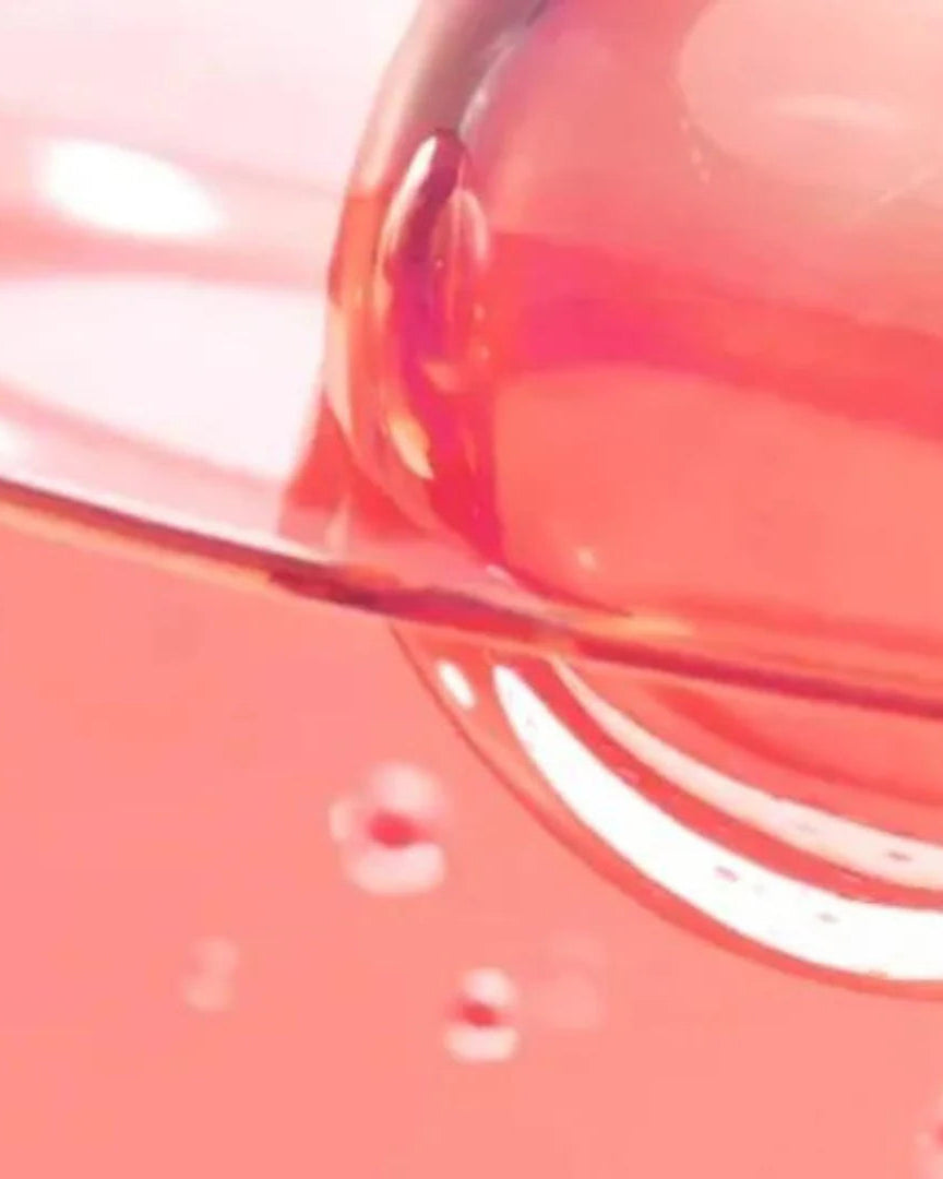 Close-up of a pink liquid in a container with a spoon