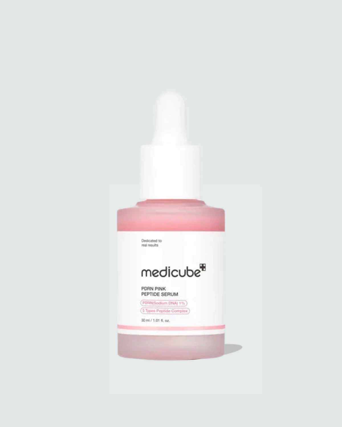Medicube facial serum bottle on a light gray background