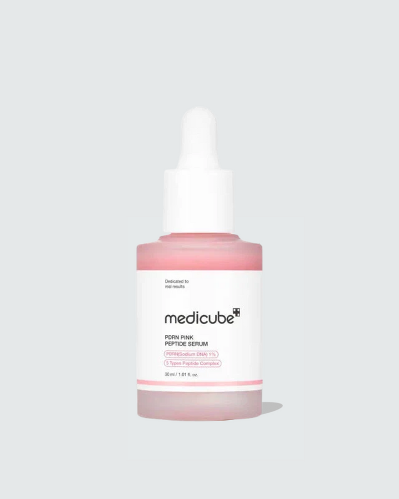 Medicube facial serum bottle on a light gray background